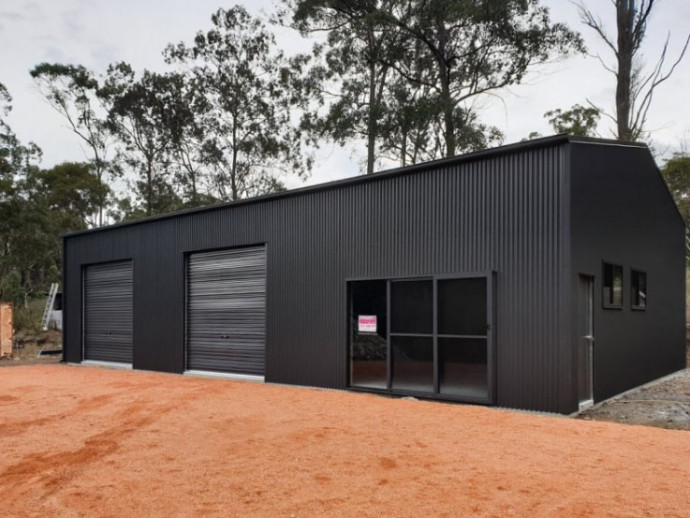 boss in black shed feature hero